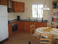 Kitchen in guest villa with dining area