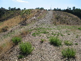 Track upward from flat plot of land