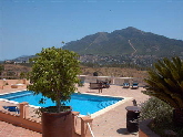 Swimming pool, terraces and mountain view